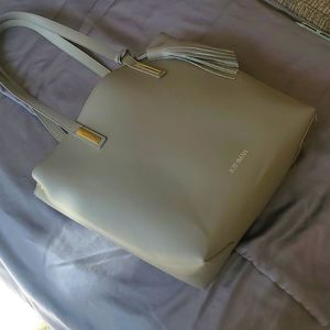 Joy & Iman Tassle Tote with canvas insert.